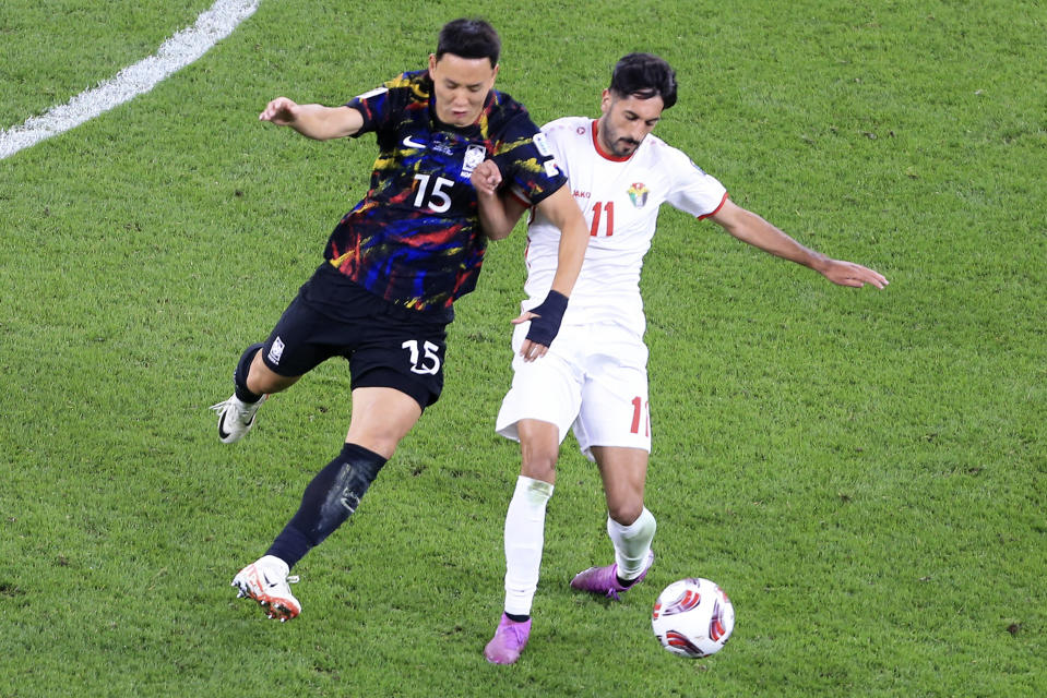 Jordan's Yazan Alnaimat, right, and South Korea's Jung Seung-hyun battle for the ball during the Asian Cup semifinal soccer match between South Korea and Jordan at Ahmad Bin Ali Stadium in Al Rayyan, Qatar, Tuesday, Feb. 6, 2024. (AP Photo/Hussein Sayed)