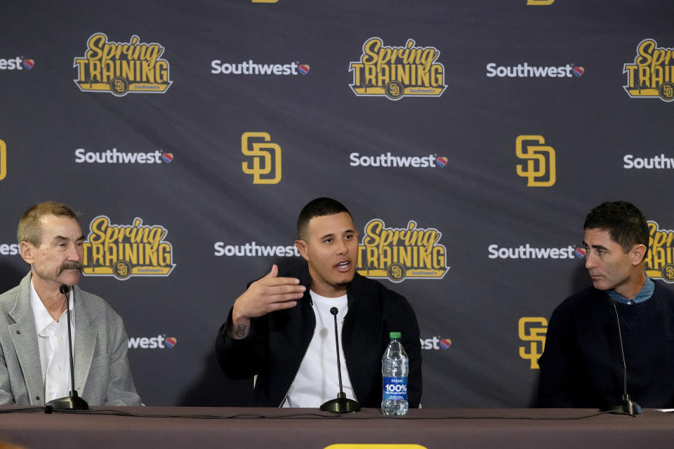 San Diego Padres third baseman Manny Machado talks agout his 11-year contract extension while owner Peter Seidler, left, and general manager A. J. Preller look on Tuesday, Feb. 28, 2023, at the team's spring training baseball facility in Peoria, Ariz. (AP Photo/Charlie Riedel)