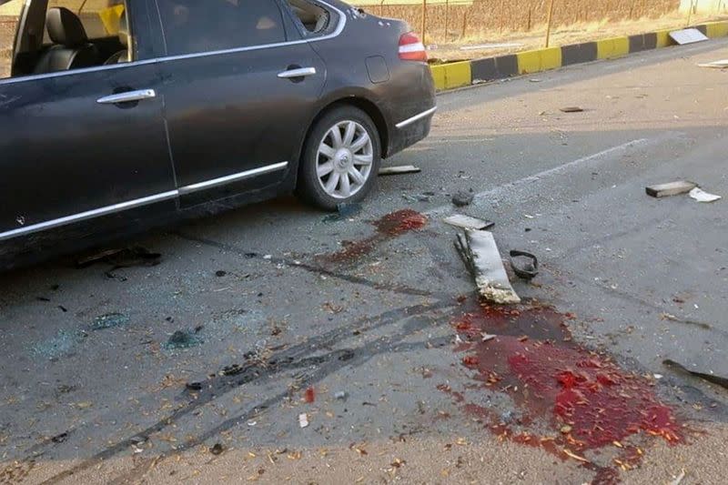 Blood stains are seen on the ground at the site of the attack that killed Prominent Iranian scientist Mohsen Fakhrizadeh, outside Tehran
