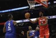 Joel Embiid of the Philadelphia 76ers shoots during the second half of the NBA All-Star basketball game Sunday, Feb. 16, 2020, in Chicago. (AP Photo/Nam Huh)