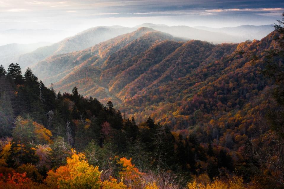 The sun rises on Cool Autumn Morning in the Great Smoky Mountains National Park via Getty Images