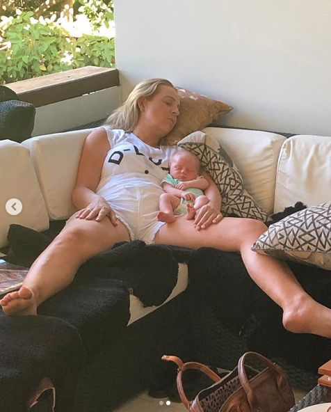 The second photo shows Carrie spread out on the couch with Adelaide nested in her arm. Photo: Instagram/Carrie Bickmore