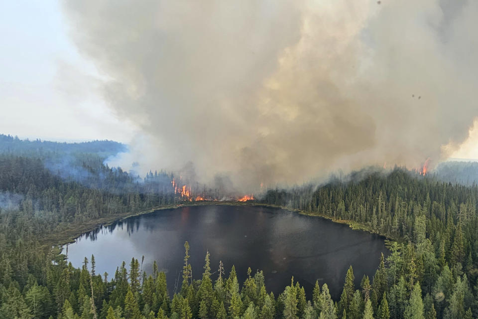 In this image released by the Ontario Ministry of Natural Resources and Forestry, the Chapleau 3 wildfire burns near the township of Chapleau, Ontario, on Sunday, June 4, 2023. (Ontario Ministry of Natural Resources and Forestry/The Canadian Press via AP)