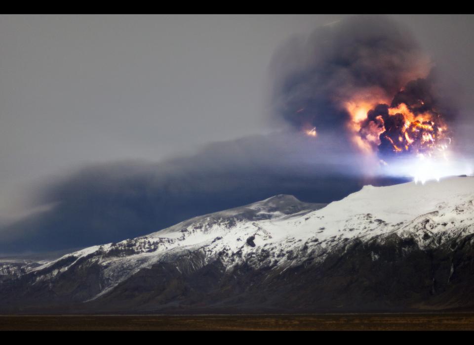 Lightning is seen within a cloud of volcanic matter as it rises from the erupting Eyjafjallajokull volcano April 20, 2010 Eyjafjallajokull, Iceland. A major eruption occurred on April 14, 2010 which has resulted in a plume of volcanic ash being thrown into the atmosphere over parts of Northern Europe. Air traffic has been subject to cancellation or delays, as airspace across parts of Northern Europe has been closed.  (Photo by Terje Sorgjerd/Getty Images)