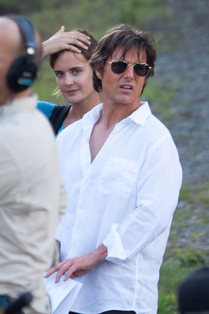Tom Cruise certainly has a type! The actor was spotted on the set of his new film <em>Mena</em> alongside his young assistant, who bears a striking resemblance to Cruise’s ex-wife Katie Holmes. AKM/GSI <strong>NEWS: Is Scientology Keeping Tom Cruise From Seeing Suri?</strong> The <em>Mission: Impossible</em> actor stars as real-life drug smuggler Barry "El Gordo" Seal in the new true crime film, and his assistant has been by his side as the production films through the hot Atlanta summer. AKM/GSI <strong>NEWS: It's Been 10 Years Since Tom Cruise Jumped on Oprah's Couch</strong> Holmes told <em>People</em> last year that she doesn’t want her marriage to Cruise to define her, saying "I don't want that to be what I'm known as." However, if rumors of a flirtation between the action star and his assistant are to be believed, it seems he might not be as over the relationship as his ex-wife. <strong>WATCH: Tom Cruise Goes Shirtless, Hangs Off a Plane in 'Mission: Impossible Rogue Nation' Trailer</strong> Check out Cruise’s death defying stunt work for the latest <em>Mission: Impossible</em> installment in the video below!
