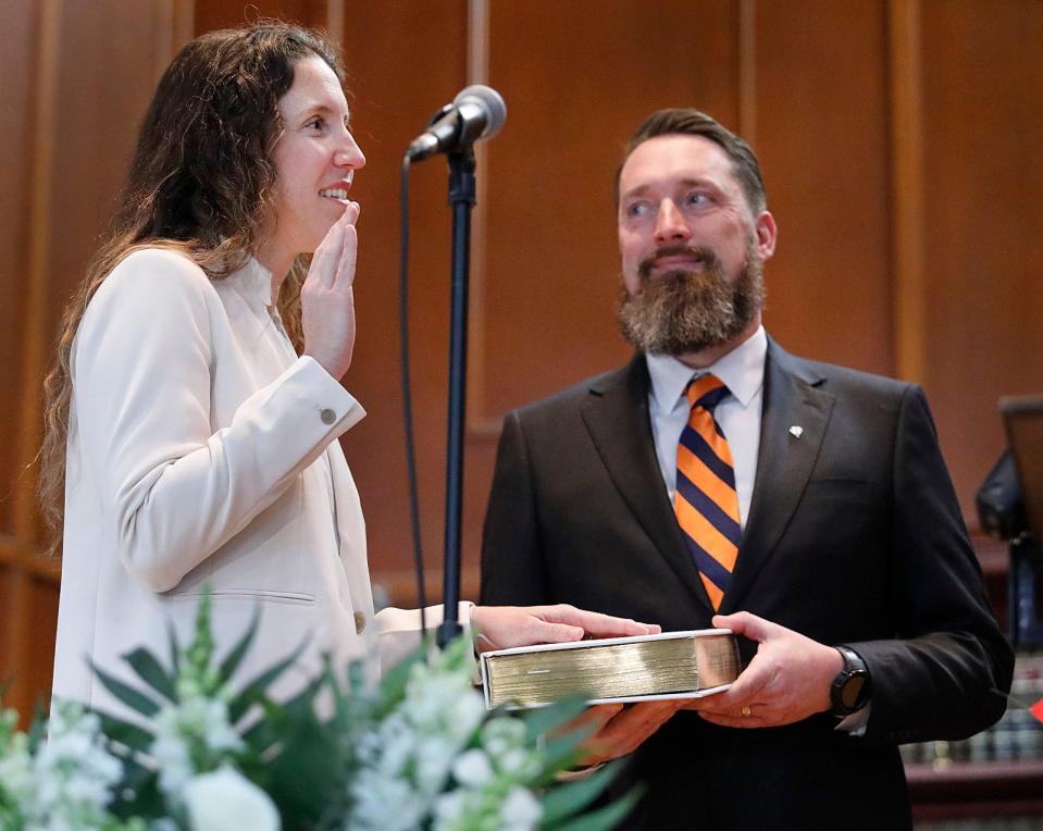 Mayor Erin Joyce is sworn in by Lt. Gov. Kim Driscoll as Joyce's husband, Michael, holds the family Bible on Tuesday, Jan. 2, 2024, at town hall.