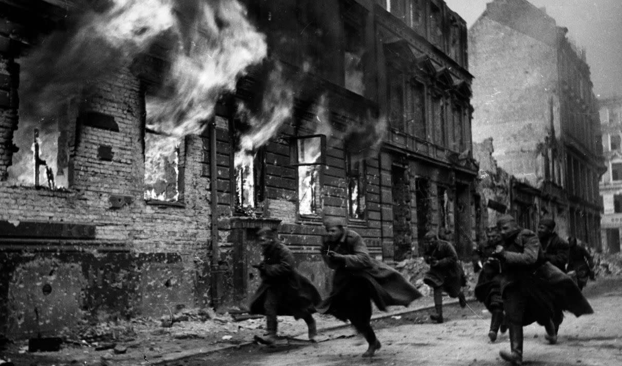  Russian assault troops charge down a street during the advance through Poland. 