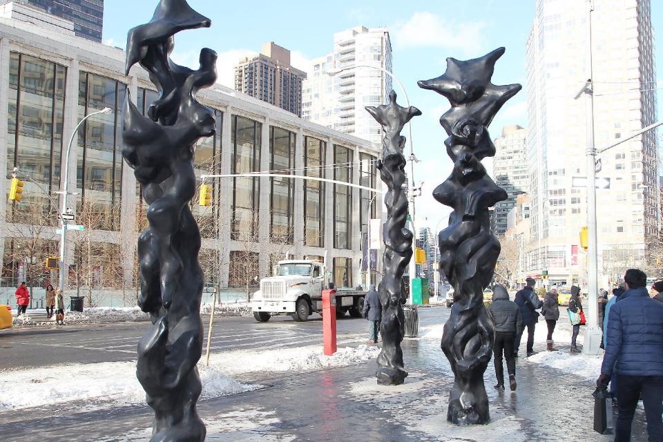 This image released by Starpix shows three black bronze totem sculptures by musician-artist Herb Alpert on display at Dante Park on west 64th Street and Broadway,Thursday, Jan 23, 2014 in New York. The sculptures will be on display until April 15. (AP Photo/Starpix, Dave Allocca)