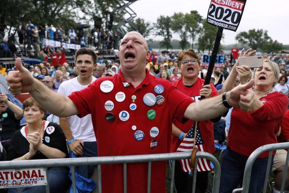 Mark Thompson, of Urbandale, Iowa, listens to Democratic presidential candidate Sen. Cory Booker speak at the Polk County Democrats Steak Fry, Saturday, Sept. 21, 2019, in Des Moines, Iowa. (AP Photo/Charlie Neibergall)