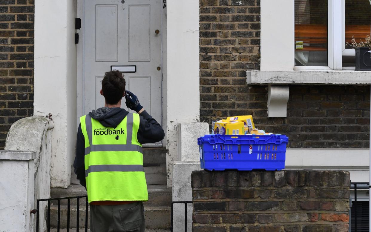 Food is delivered to a shielding household during the first wave of the Covid pandemic - Andy Rain/Shutterstock