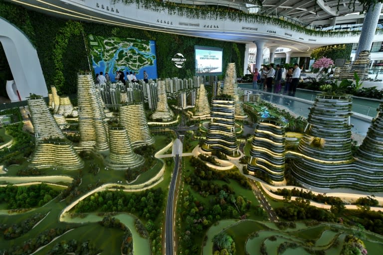 Visitors view a scale model of the Forest City development on one of the man-made islands off Malaysia