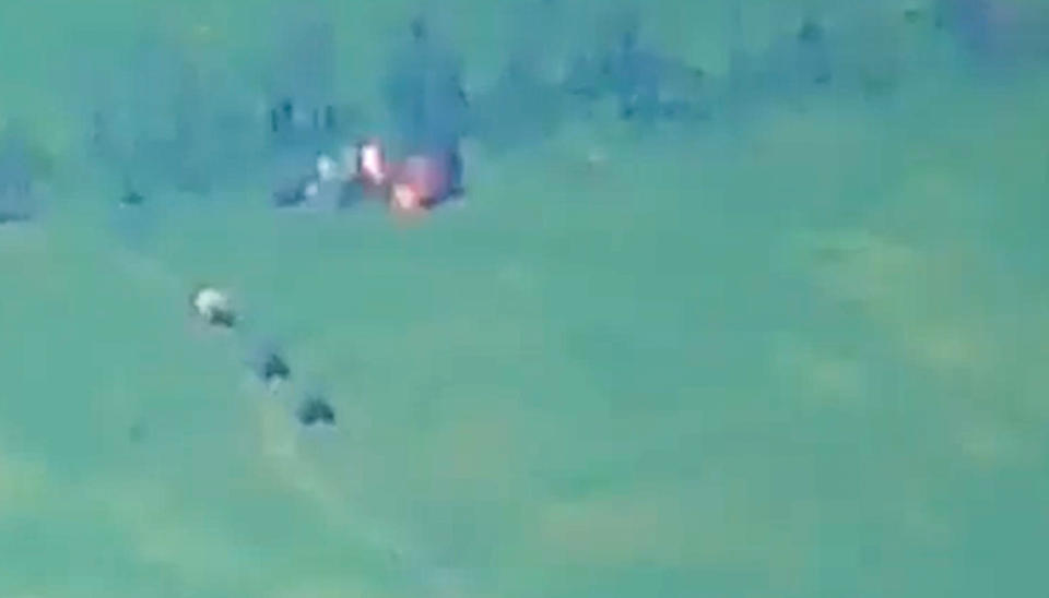 This photo taken from video released by Russian Defense Ministry Press Service on Monday, June 5, 2023, show a Ukrainian military vehicle being hit during a combat in Ukraine. The Russian Defense Ministry said the Russian military fended off an attempt by Ukraine to launch an attack in the southern part of the Donetsk region on Sunday. (Russian Defense Ministry Press Service via AP)