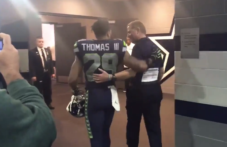 Earl Thomas ran into the Cowboys locker room after the game to talk to Dez Bryant, and met Jason Garrett on his way there. (Twitter/@EdwardEgrosFox4)