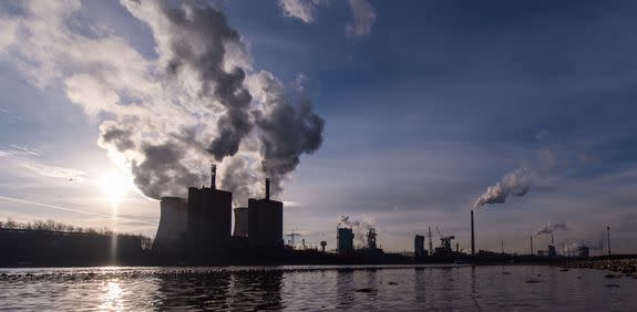 Steam and exhaust rise from a power station in Germany.