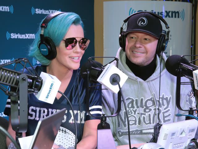 Cindy Ord/Getty Jenny McCarthy and Donnie Wahlberg attend SiriusXM at Super Bowl LII Radio Row at the Mall of America