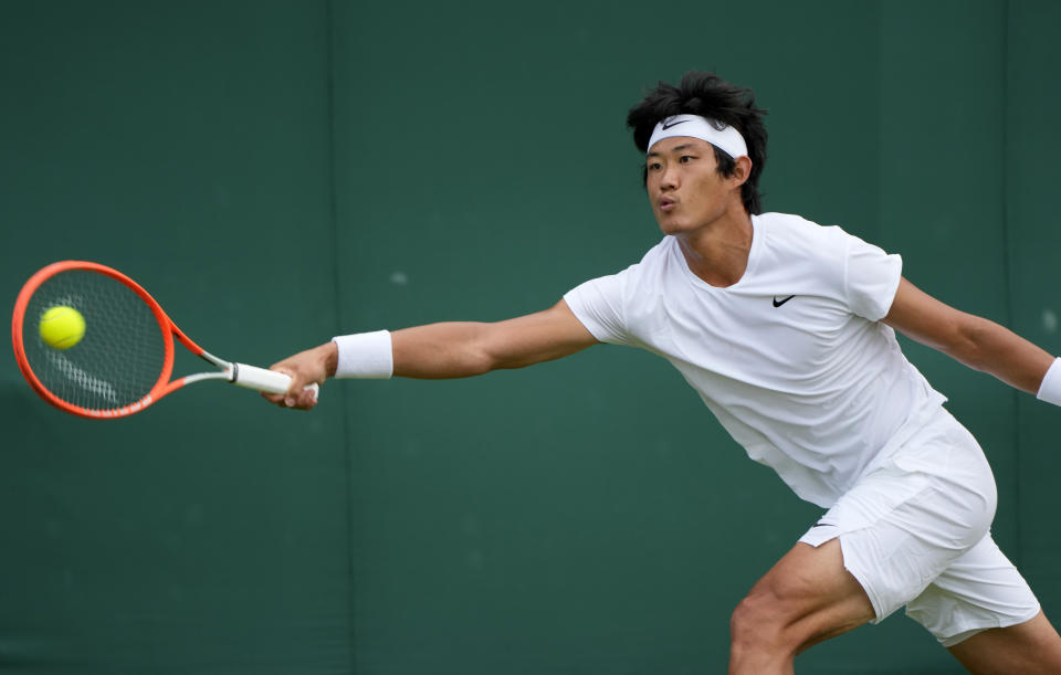 China's Zhizhen Zhang plays a return to Antoine Hoang of France during the men's singles first round match on day two of the Wimbledon Tennis Championships in London, Tuesday June 29, 2021. (AP Photo/Alastair Grant)