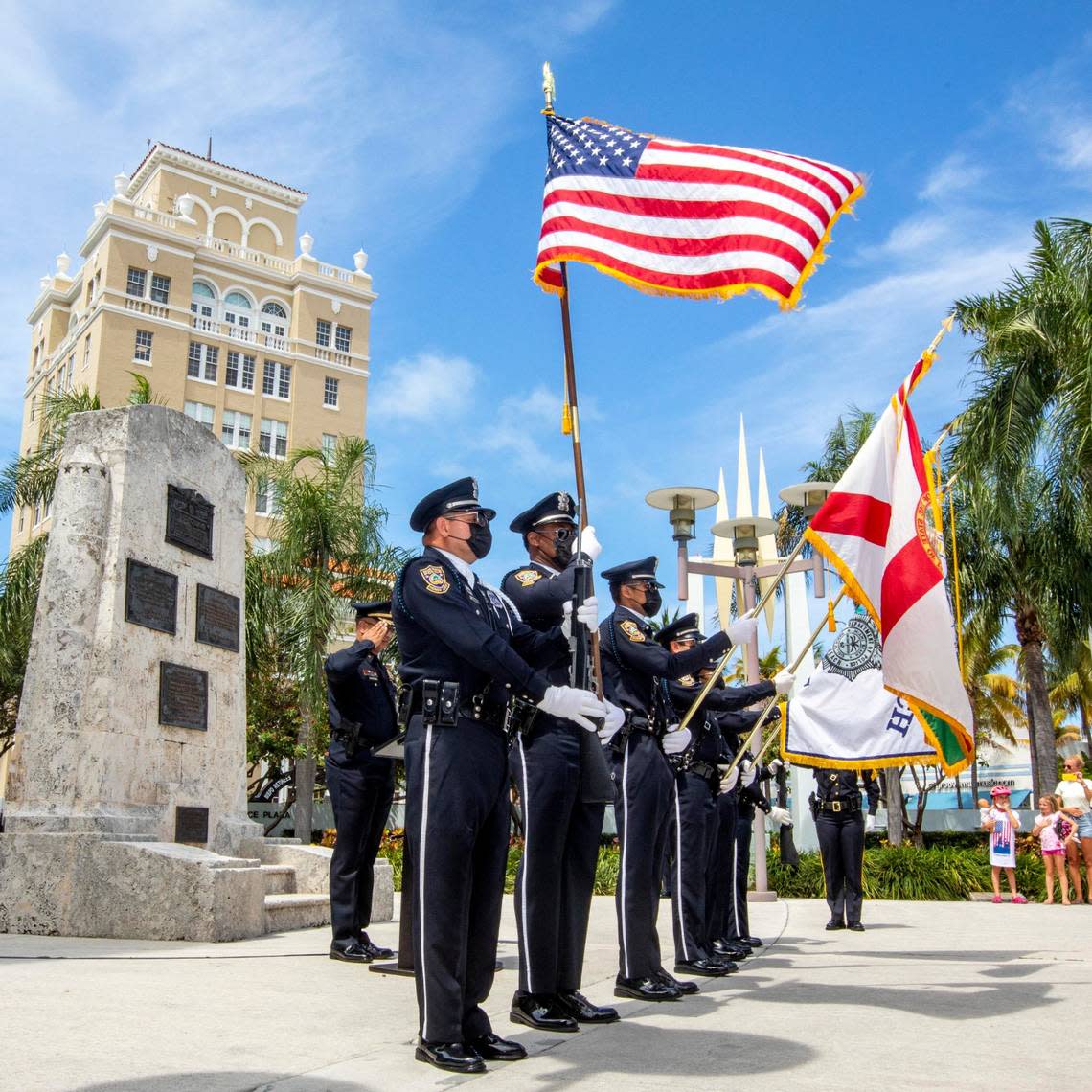File photo of a police honor guard saluting the holiday in Miami Beach on Memorial Day 2021.