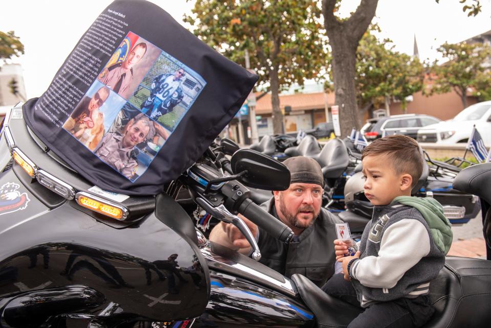 (2022/06/04) David Corr with The Beyond the Call of Duty organization with Jimmy Inn's son on one of their motorcycles Saturday morning.  The organization was at the Stockton Police Department Saturday morning to honor Officer Jimmy Inn who was killed in the line of duty,  The group is a 501(c)3 nonprofit organization dedicated to raising awareness of first responders lost in the line of duty and to support the families and communities of the fallen.