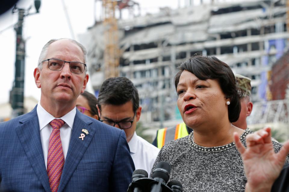 New Orleans Mayor Latoya Cantrell and Louisiana Gov. John Bel Edwards address reporters near the Hard Rock Hotel Oct. 17, 2019, in New Orleans. The 18-story hotel project that was under construction collapsed last Saturday, killing three workers. Two bodies remain in the wreckage.