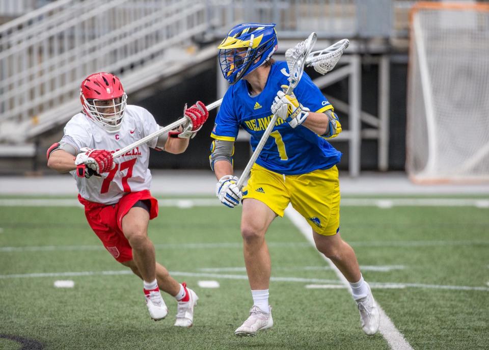 Delaware's J.P. Ward looks for an open teammate in Sunday's NCAA Lacrosse Tournament quarterfinal against Cornell at Ohio Stadium.