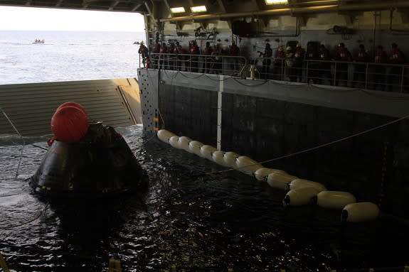 NASA’s Orion spacecraft is pulled into the well deck of the U.S. Navy’s USS Anchorage after its splashdown in the Pacific Ocean on Dec. 5. 2014. Orion successfully completed its first-ever test flight that day, an unmanned effort called Explora