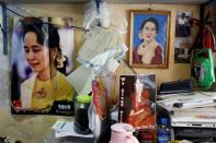 Photos of Myanmar State Counselor Aung San Suu Kyi are seen in a shop in Yangon