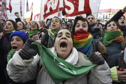 Abortion rights activists in Buenos Aires celebrate after the lower chamber of Argentina's Congress approved a bill legalizing abortion - a measure that still needs Senate approval to become law