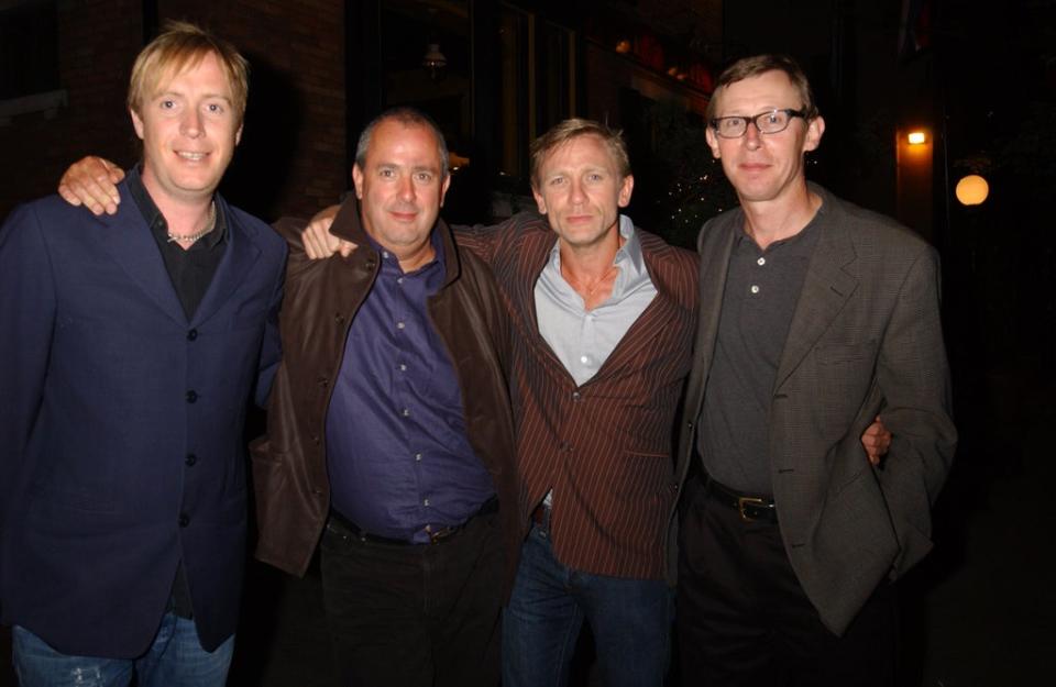 Michell with Rhys Ifans, Daniel Craig and Kevin Loader (WireImage)