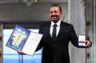 Ethiopia's Prime Minister Abiy Ahmed poses for the media after receiving the Nobel Peace Prize during the award ceremony in Oslo City Hall, Norway, Tuesday Dec. 10, 2019. (Håkon Mosvold Larsen/NTB Scanpix via AP)