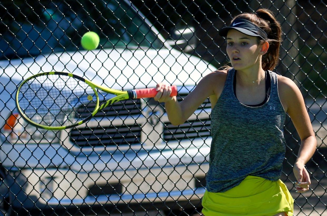 Auburndale senior Madison Newbern hits a forehand back to Orlando Edgewater's Addison Taylor at their No. 4 singles match on Thursday in the Class 3A region finals.