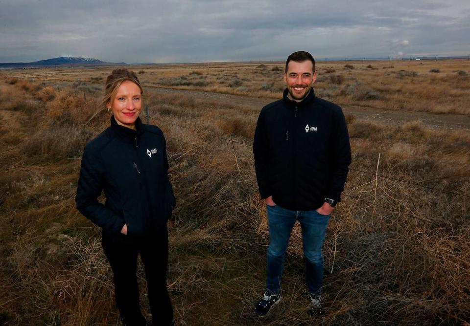 Gina Zejdlik, Atlas Agro director of policy and government relations, and Dan Holmes, Atlas Agro North America executive director, stand in March 2023 at the 150 acres on the northern edge of Richland the Port of Benton commission voted to sell to the company earlier in the day. Atlas Agro plans to build the first-ever carbon-free fertilizer production plant at a cost of $1.1 billion on the land.