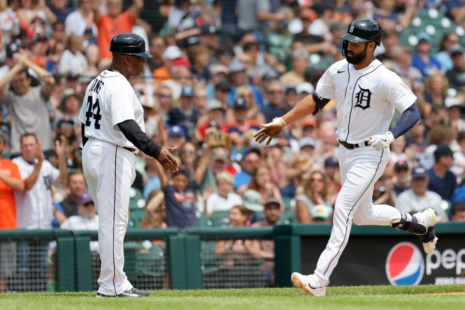 Detroit Tigers center fielder Riley Greene (31) receives congratulations from third base coach Gary Jones (44) after he hits a home run in the third inning against the Toronto Blue Jays at Comerica Park in Detroit, Michigan on July 9, 2023.