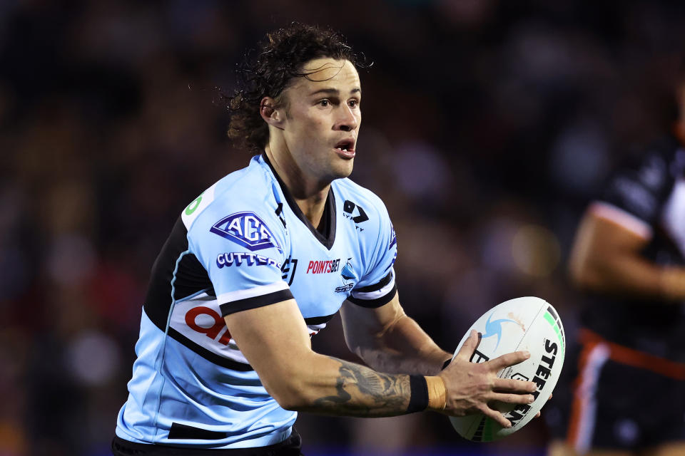 Seen here, Nicho Hynes running the ball during an NRL game for the Sharks. 