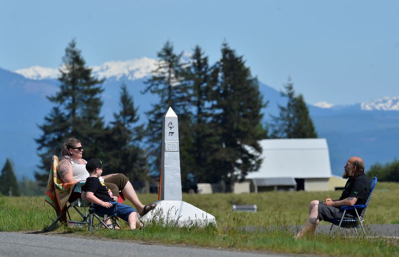 FILE PHOTO: Roadside meetups along the Canada-U.S. border in Langley, British Columbia.