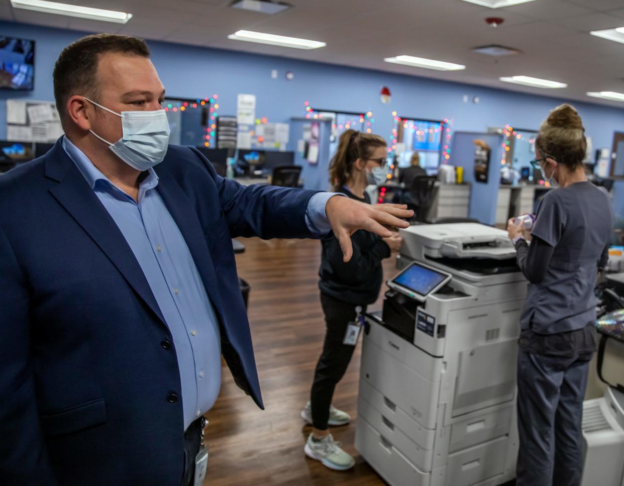 Michael Randolph, who helps oversee the mental health workers in the Partners in Care program, describes the work going on at the Crisis Response Center on Dec. 2.