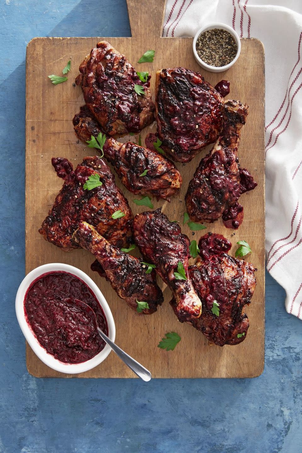 blackberry glazed chicken on a wooden serving board