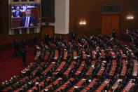 A screen shows Chinese President Xi Jinping as delegates attend the closing session of the National People's Congress (NPC) at the Great Hall of the People in Beijing, Monday, March 11, 2024. (AP Photo/Andy Wong)