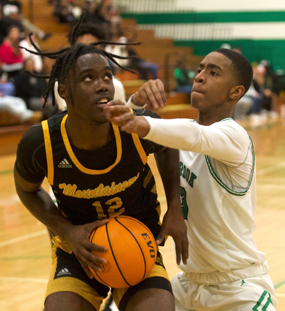 Kings Mountain's Curtis Simpson hesitates just before rising for a shot against Ashbrook on Jan. 14, 2021 in Gastonia.