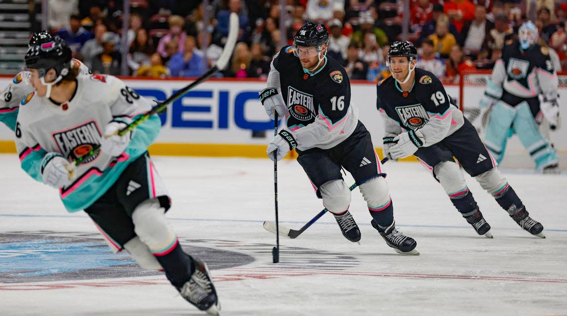 Atlantic Division’s Aleksander Barkov (16) and Matthew Tkachuk (19) chase the puck during the game against the Metropolitan Division during the NHL All-Star Game at FLA Live Arena in Sunrise, Florida on Saturday, February 4, 2023.