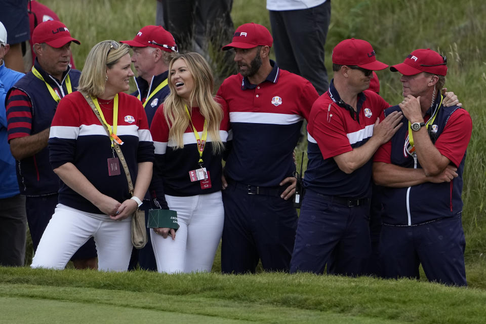 Team USA captain Steve Stricker is congratulated by assistant captain Zack Johnson after the Ryder Cup matches at the Whistling Straits Golf Course Sunday, Sept. 26, 2021, in Sheboygan, Wis. (AP Photo/Jeff Roberson)