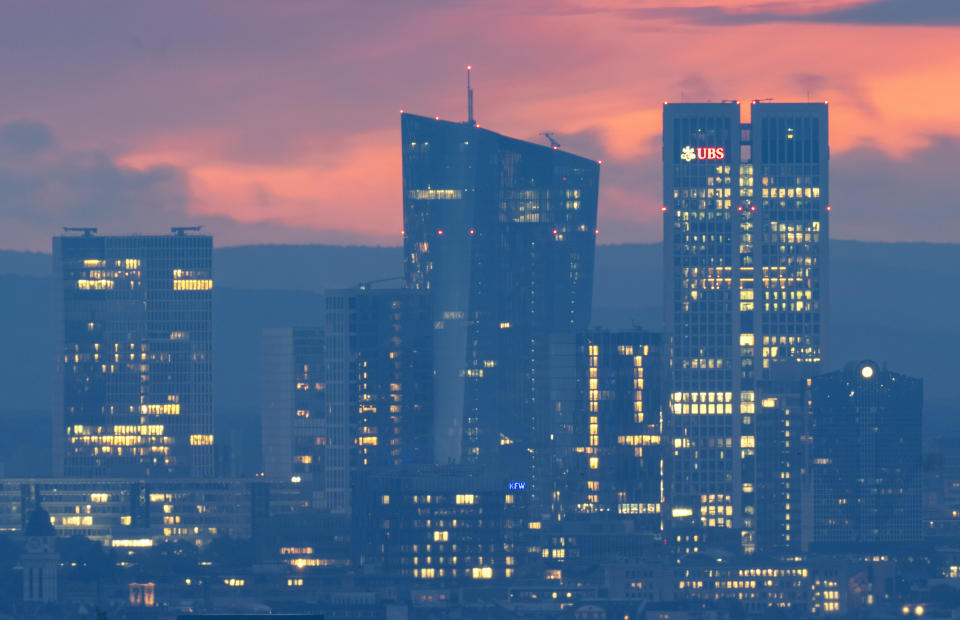 The European Central Bank, centre, is pictured before sunrise in Frankfurt, Germany, Thursday, Oct. 26, 2023. The ECB's governing council will meet in Athens on Thursday. (AP Photo/Michael Probst)