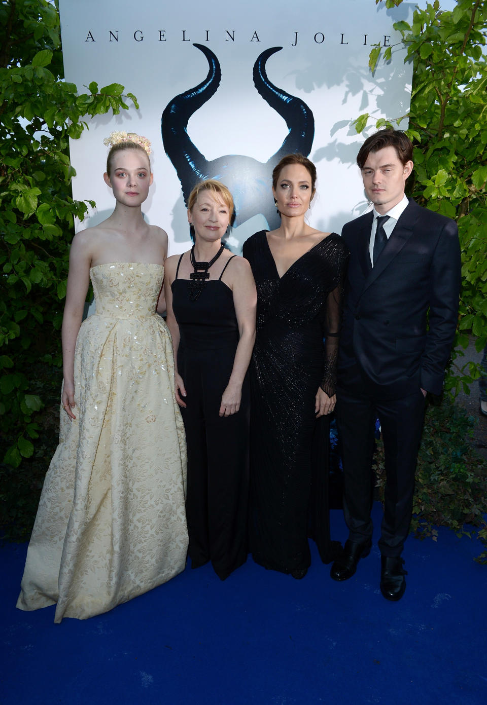 From left, actors Elle Fanning, Leslie Manville, Angelina Jolie and Sam Riley arrive for the Maleficent exhibit in Kensington Gardens, London, Thursday, May 8, 2014. The exhibit showcases some of the costumes and props from the film Maleficent, before they go on display to the public at the O2 in London. (Photo by Jon Furniss/Invision for/AP Images)