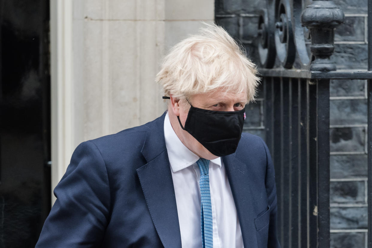 LONDON, UNITED KINGDOM - MAY 12, 2021: British Prime Minister Boris Johnson leaves 10 Downing Street for the House of Commons to give MPs an update on Covid-19 and lifting restrictions in England ahead of the second day Queen's Speech debate, on 12 May, 2021 in London, England. (Photo credit should read Wiktor Szymanowicz/Barcroft Media via Getty Images)