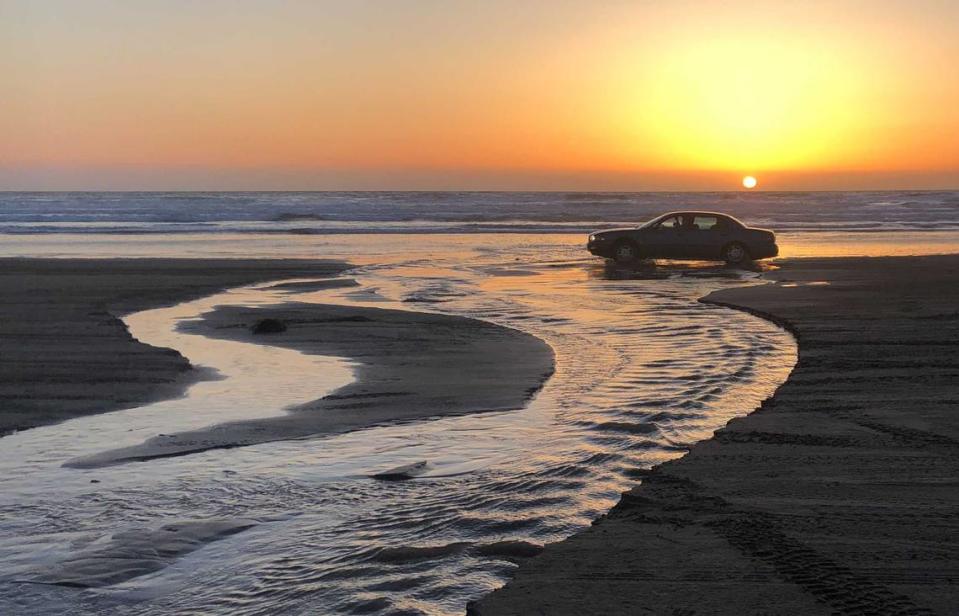 A car crosses Arroyo Grande Creek at Oceano Dunes State Vehicular Recreation Area in March 2021.