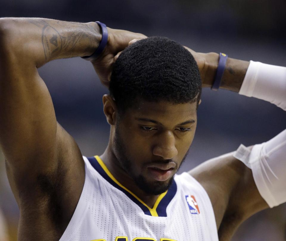 Indiana Pacers' Paul George reacts during the first half in Game 5 of an opening-round NBA basketball playoff series against the Atlanta Hawks Monday, April 28, 2014, in Indianapolis. (AP Photo/Darron Cummings)