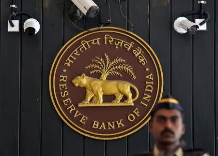 A security personnel member stands guard at the entrance of the Reserve Bank of India (RBI) headquarters in Mumbai, India, August 2, 2017. REUTERS/Shailesh Andrade/Files