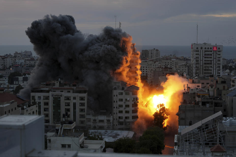 FILE - A ball of fire and smoke rise from an explosion on a Palestinian apartment tower following an Israeli air strike in Gaza City, Saturday, Oct. 7, 2023. The militant Hamas rulers of the Gaza Strip carried out an unprecedented, multi-front attack on Israel at daybreak Saturday, firing thousands of rockets as dozens of Hamas fighters infiltrated the heavily fortified border in several locations by air, land, and sea and catching the country off-guard on a major holiday. (AP Photo/Adel Hana, File)