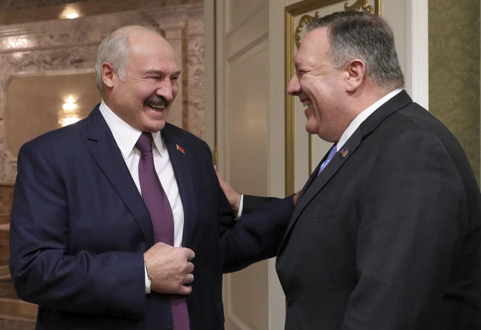 Belarusian President Alexander Lukashenko, left, and U.S. Secretary of State Mike Pompeo smile as they talk to each other during their meeting in Minsk, Belarus, Saturday, Feb. 1, 2020. In Minsk, Pompeo plans to affirm the U.S. commitment to improving ties with Belarus, which has had a strained relationship with Russia. (Nikolai Petrov/BelTA Pool Photo via AP)