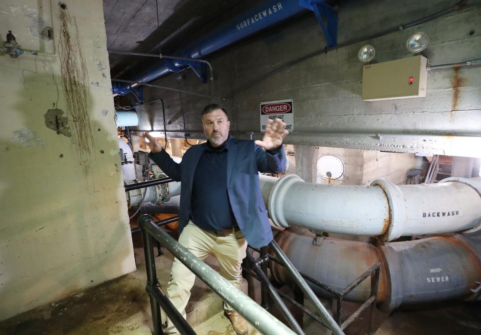 Jeffrey Bronowski, Akron water supply bureau manager, talks about infrastructure needs in the pipe gallery beneath a filtration plant at the Akron Water Supply facility near Lake Rockwell in Kent.