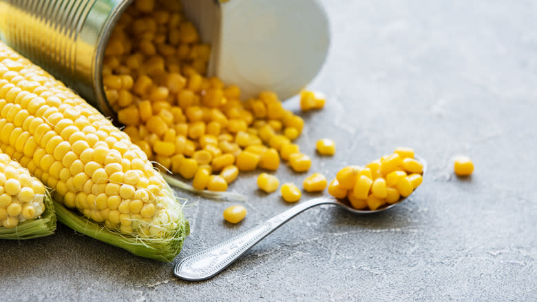 Canned sweetcorn spilling out of the can